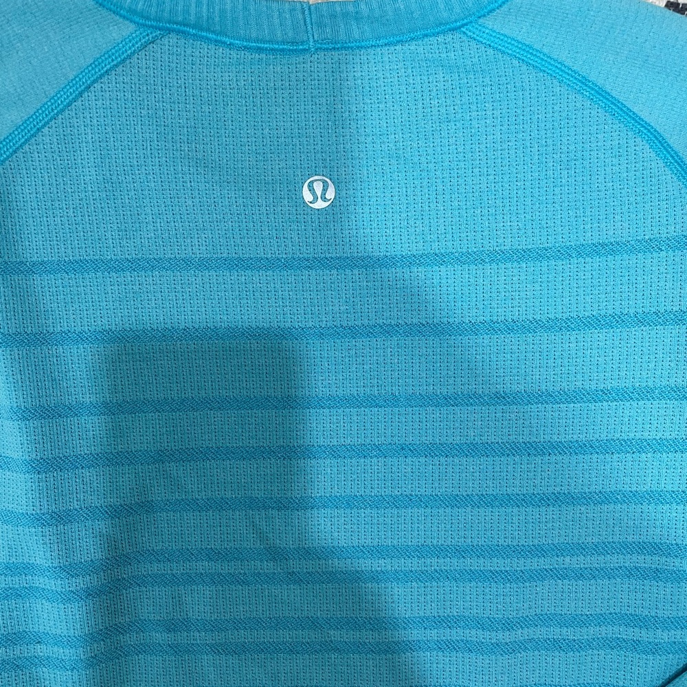 Size 10 long sleeved swiftly Tee. Baby blue